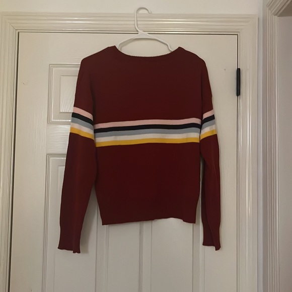 Cute Red Sweater with singular colorful stripes across the chest. - Picture 2 of 2